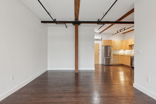 2 Main St Unit 35-203, Biddeford, ME 04005 - unfurnished living room with dark wood-style flooring, a wall mounted air conditioner, baseboards, and a sink