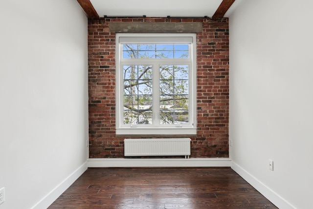 2 Main St Unit 35-203, Biddeford, ME 04005 - unfurnished room with radiator heating unit, baseboards, and hardwood / wood-style flooring