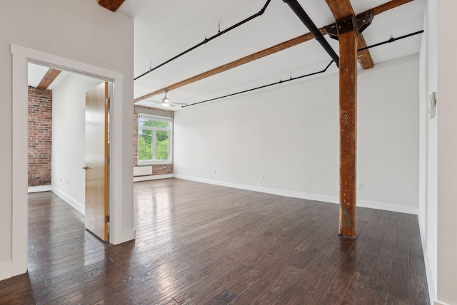 2 Main St Unit 35-203, Biddeford, ME 04005 - unfurnished living room featuring wood-type flooring, a ceiling fan, baseboards, and beam ceiling
