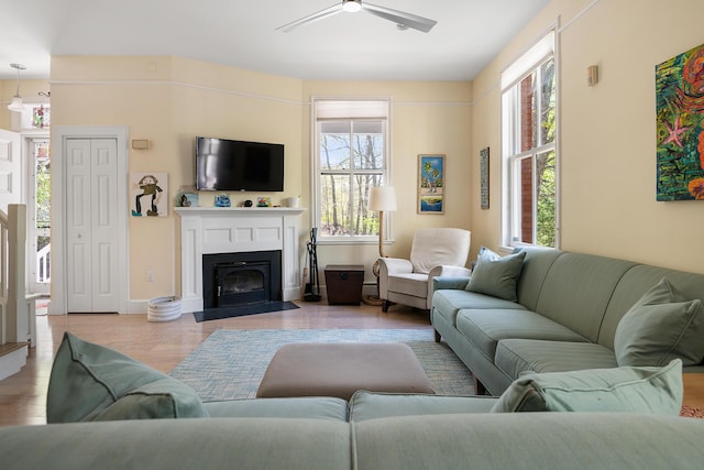 28 Ingalls Rd Unit 28, Portland, ME 04109 - living room featuring ceiling fan, a fireplace with flush hearth, and wood finished floors