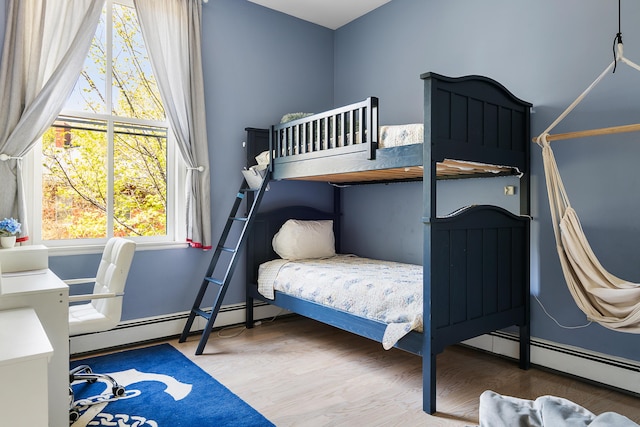 28 Ingalls Rd Unit 28, Portland, ME 04109 - bedroom with a baseboard radiator and wood finished floors