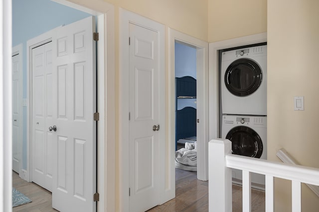 28 Ingalls Rd Unit 28, Portland, ME 04109 - laundry area featuring stacked washer / dryer and light wood-style flooring