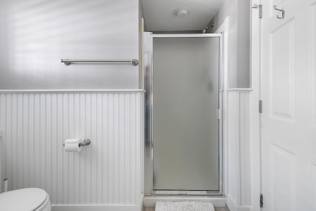 28 Ingalls Rd Unit 28, Portland, ME 04109 - full bath with a shower stall, toilet, and a wainscoted wall