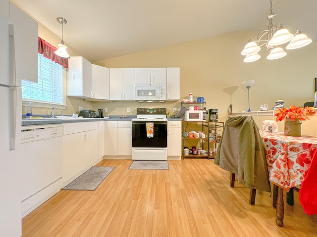 23 N Garand St, Winslow, ME 04901 - kitchen featuring white appliances, light wood finished floors, white cabinetry, a chandelier, and vaulted ceiling