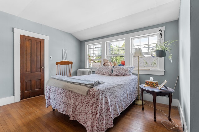 103 Green St, Augusta, ME 04330 - bedroom featuring wood-type flooring, radiator, vaulted ceiling, and baseboards