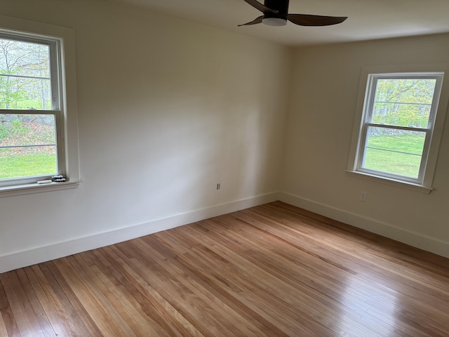 24 Chapel St, Boothbay, ME 04537 - unfurnished room featuring healthy amount of natural light, ceiling fan, and baseboards