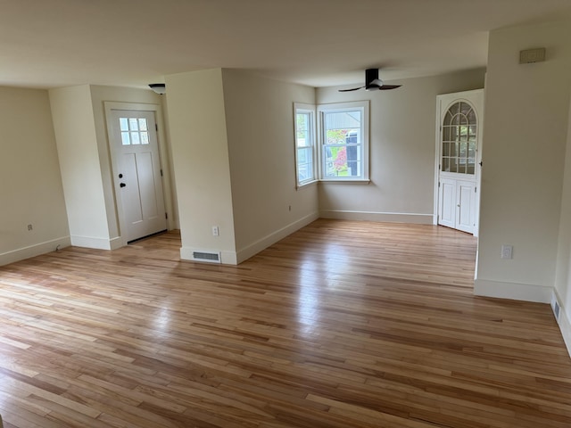 24 Chapel St, Boothbay, ME 04537 - empty room with a ceiling fan, light wood finished floors, and baseboards