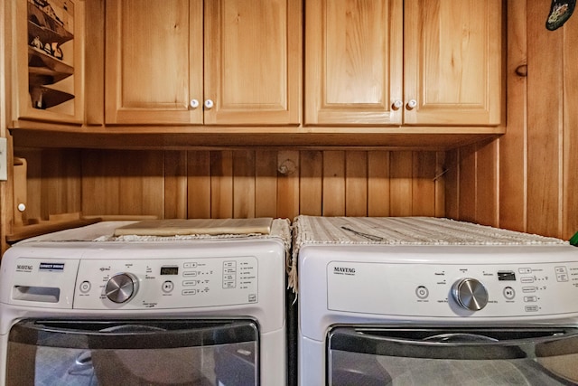 580 Norway Rd, Waterford, ME 04088 - washroom featuring separate washer and dryer, cabinet space, and wooden walls