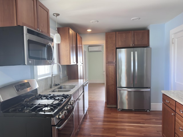 128 Fern St, Bangor, ME 04401 - kitchen featuring stainless steel appliances, a sink, dark wood-style floors, a wall mounted air conditioner, and recessed lighting