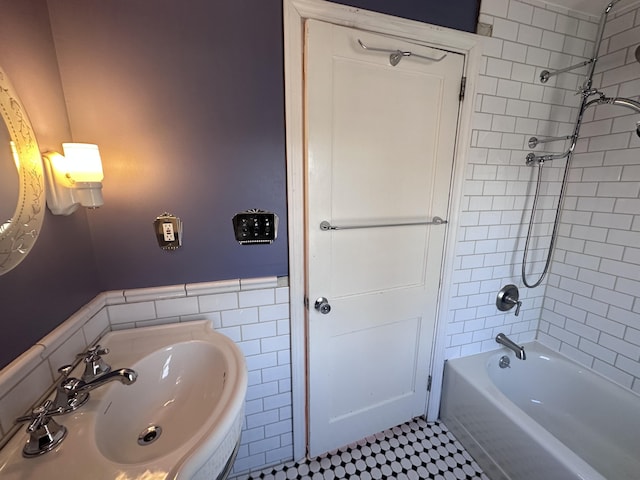 128 Fern St, Bangor, ME 04401 - full bathroom featuring a sink, tile walls, wainscoting, and bathtub / shower combination