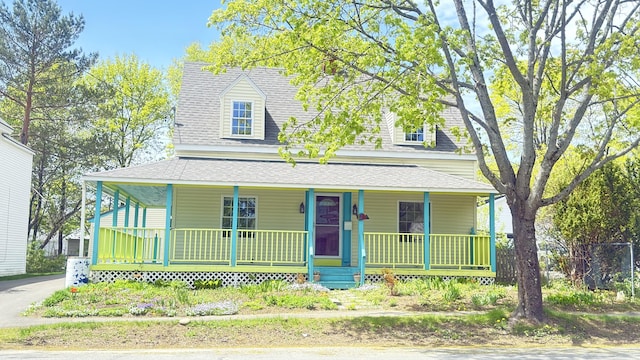 128 Fern St, Bangor, ME 04401 - view of front facade featuring a porch and roof with shingles