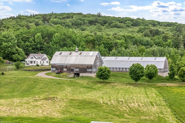 661 Veterans Hwy, Brooks, ME 04921 - aerial view of property and surrounding area with a forest