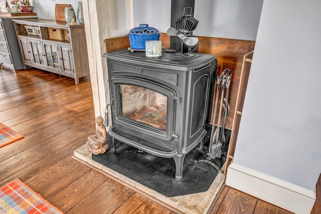 661 Veterans Hwy, Brooks, ME 04921 - detailed view of wood finished floors and a wood stove