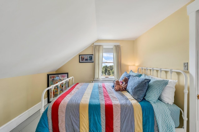 661 Veterans Hwy, Brooks, ME 04921 - bedroom featuring vaulted ceiling and baseboards
