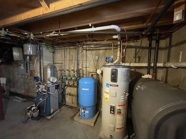 20 Chase Brook Dr, Alexander, ME 04694 - utilities with hybrid water heater, oil tank, a heating unit, and electric panel