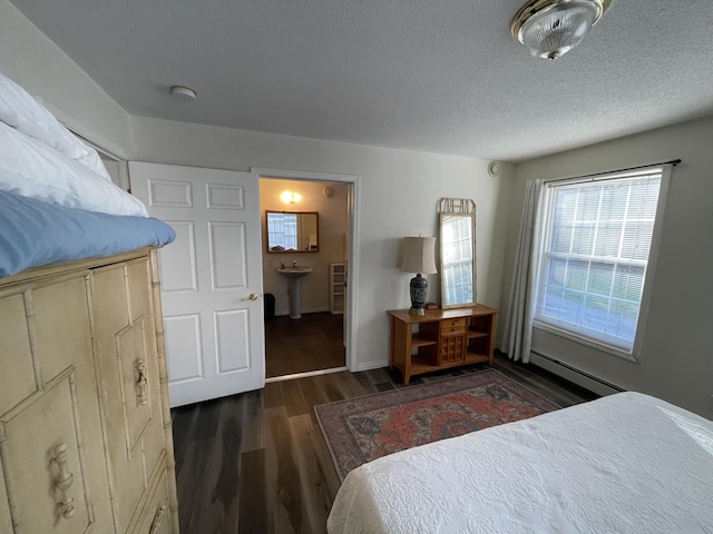 20 Chase Brook Dr, Alexander, ME 04694 - bedroom with baseboard heating, wood finished floors, and a textured ceiling
