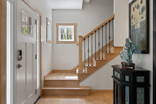 64 Old Kings Hwy, Ogunquit, ME 03907 - entryway with stairs, wood finished floors, and baseboards