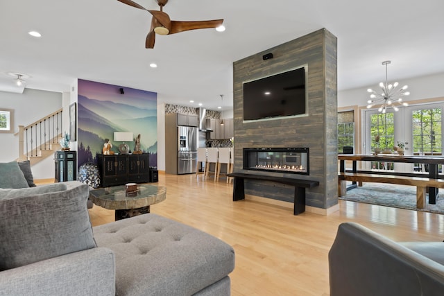 64 Old Kings Hwy, Ogunquit, ME 03907 - living room featuring light wood-type flooring, ceiling fan, a fireplace, recessed lighting, and stairs