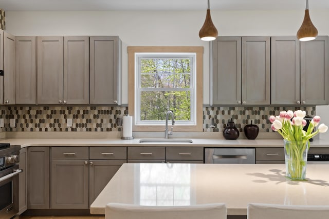 64 Old Kings Hwy, Ogunquit, ME 03907 - kitchen featuring stainless steel appliances, a sink, decorative backsplash, and light countertops
