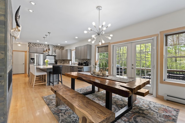 64 Old Kings Hwy, Ogunquit, ME 03907 - dining area featuring healthy amount of natural light, a chandelier, light wood-style floors, and recessed lighting
