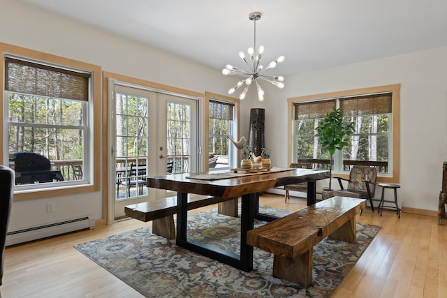 64 Old Kings Hwy, Ogunquit, ME 03907 - dining space with baseboard heating, light wood-style floors, french doors, and a chandelier
