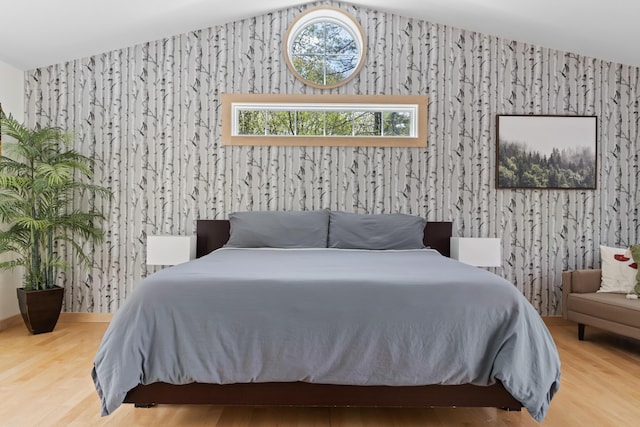 64 Old Kings Hwy, Ogunquit, ME 03907 - bedroom with wood finished floors, lofted ceiling, and wallpapered walls