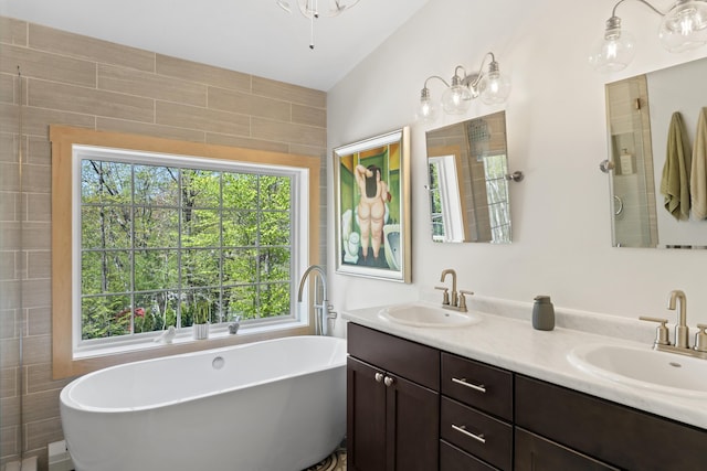 64 Old Kings Hwy, Ogunquit, ME 03907 - full bathroom featuring plenty of natural light, double vanity, and a freestanding bath