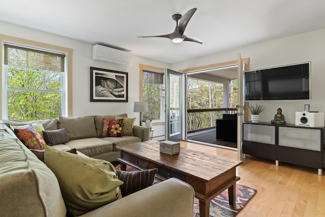 64 Old Kings Hwy, Ogunquit, ME 03907 - living area featuring a wall unit AC, plenty of natural light, light wood finished floors, and a ceiling fan