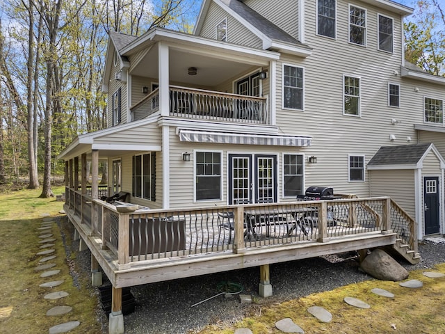 64 Old Kings Hwy, Ogunquit, ME 03907 - rear view of property featuring a balcony, french doors, roof with shingles, and a wooden deck