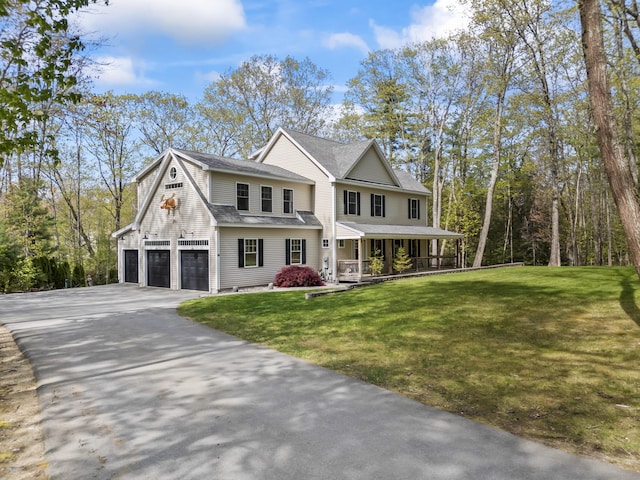 64 Old Kings Hwy, Ogunquit, ME 03907 - view of front of house featuring covered porch, concrete driveway, an attached garage, a front lawn, and a shingled roof