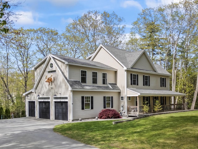 64 Old Kings Hwy, Ogunquit, ME 03907 - view of front of house featuring covered porch, a garage, a front yard, and driveway