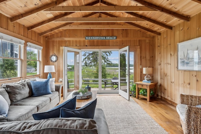 13 Atlantic Cir, Kennebunk, ME 04043 - living area featuring plenty of natural light, wooden walls, wood ceiling, and light wood finished floors
