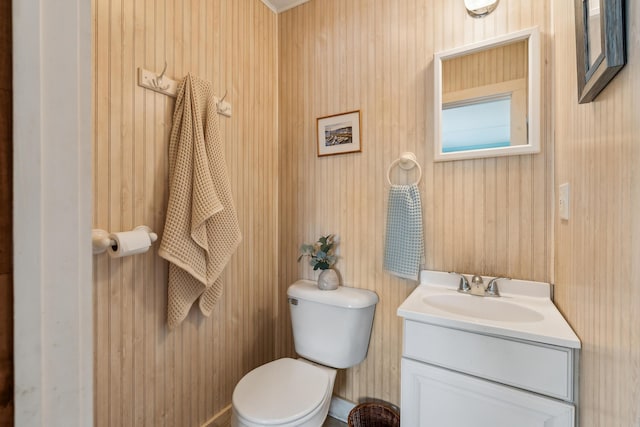 13 Atlantic Cir, Kennebunk, ME 04043 - half bath featuring toilet, vanity, and wood walls