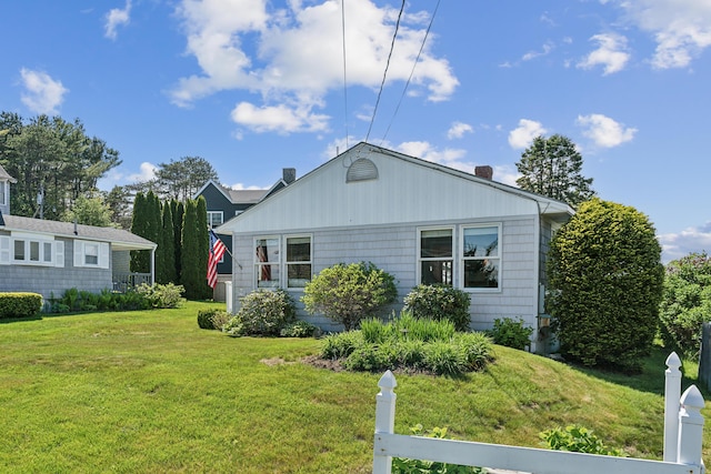 13 Atlantic Cir, Kennebunk, ME 04043 - view of property exterior featuring a yard and a chimney