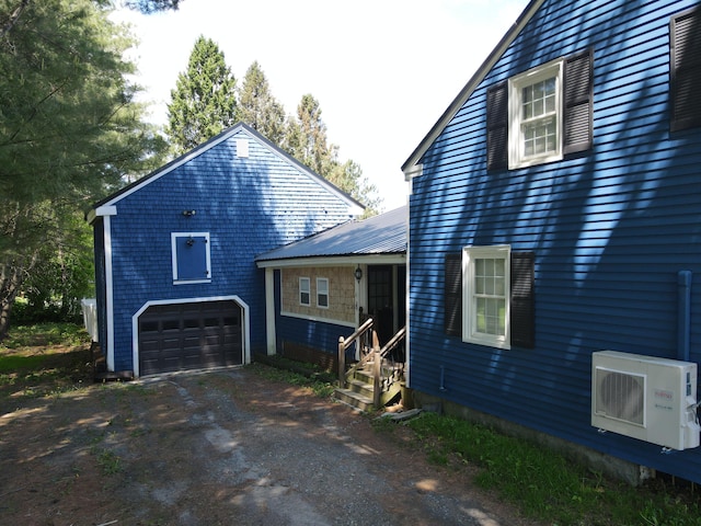 37 Enfield Rd, Lincoln, ME 04457 - view of home's exterior with ac unit, entry steps, and driveway