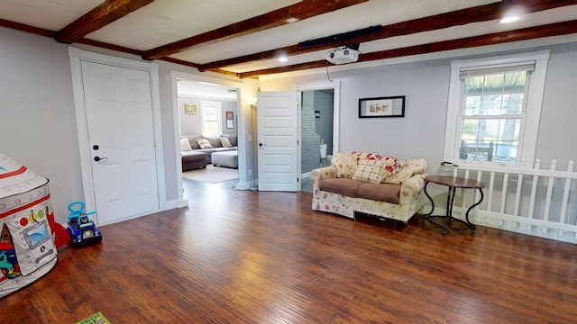 37 Enfield Rd, Lincoln, ME 04457 - living area featuring wood finished floors, beam ceiling, and baseboards