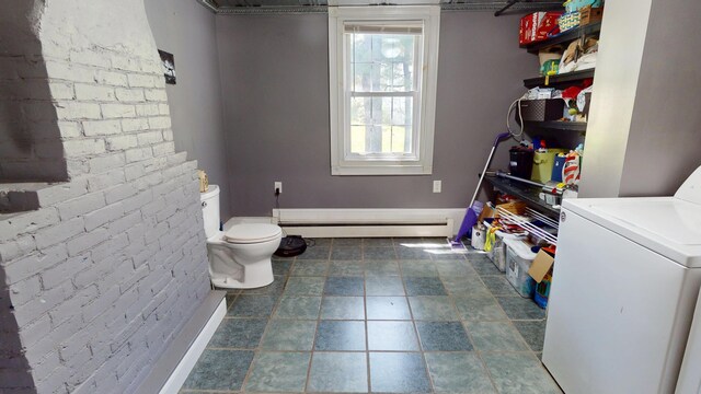 37 Enfield Rd, Lincoln, ME 04457 - half bathroom with washer / clothes dryer, baseboard heating, toilet, stone finish flooring, and baseboards