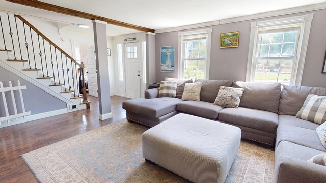 37 Enfield Rd, Lincoln, ME 04457 - living room with plenty of natural light, wood finished floors, baseboards, ornamental molding, and stairs
