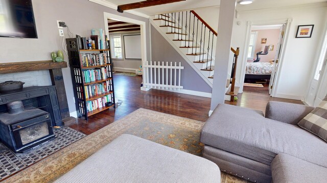 37 Enfield Rd, Lincoln, ME 04457 - living room featuring baseboards, wood finished floors, stairs, and ornamental molding