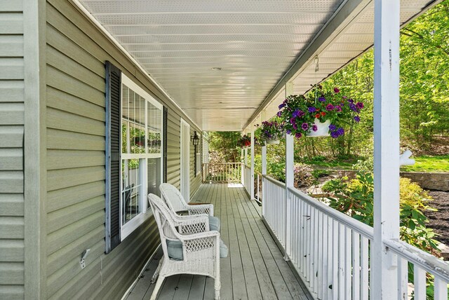 17 S Rd, Winthrop, ME 04364 - wooden deck featuring covered porch