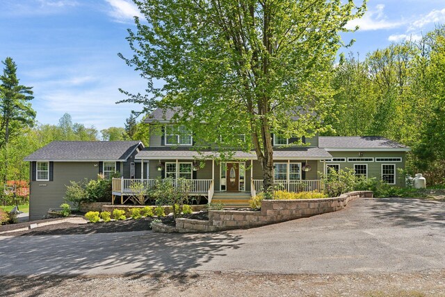 17 S Rd, Winthrop, ME 04364 - view of front of house featuring covered porch and a shingled roof