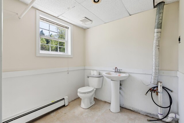 17 S Rd, Winthrop, ME 04364 - bathroom with baseboard heating, a paneled ceiling, and toilet