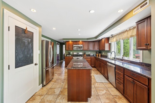 17 S Rd, Winthrop, ME 04364 - kitchen with appliances with stainless steel finishes, a sink, a kitchen island, dark stone counters, and recessed lighting
