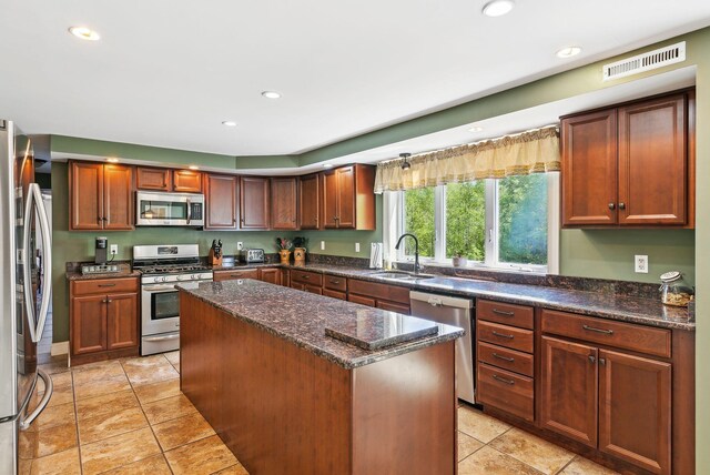17 S Rd, Winthrop, ME 04364 - kitchen featuring stainless steel appliances, a sink, a center island, recessed lighting, and dark stone countertops