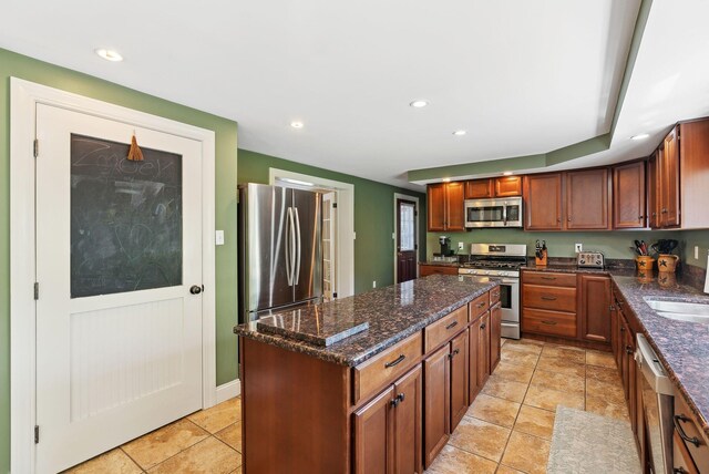 17 S Rd, Winthrop, ME 04364 - kitchen featuring appliances with stainless steel finishes, a center island, dark stone counters, recessed lighting, and a sink