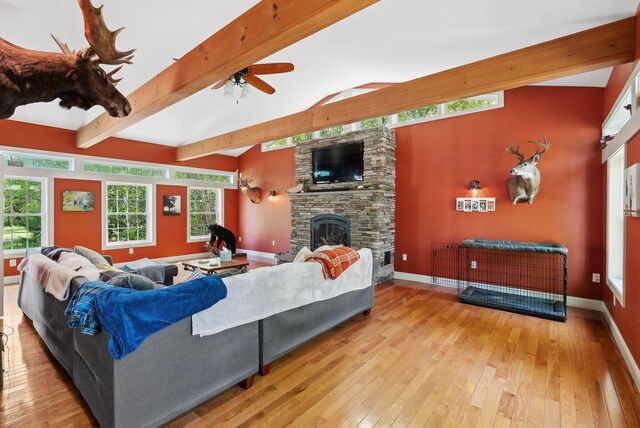 17 S Rd, Winthrop, ME 04364 - living area featuring ceiling fan, wood-type flooring, baseboards, and a stone fireplace