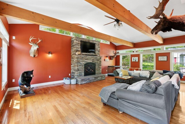 17 S Rd, Winthrop, ME 04364 - living room with wood-type flooring, a fireplace, a ceiling fan, and baseboards