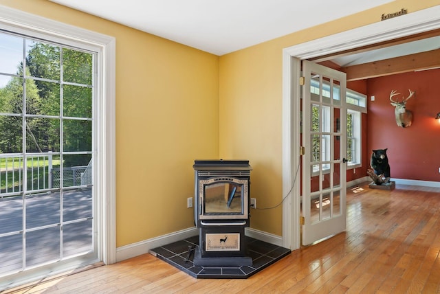 17 S Rd, Winthrop, ME 04364 - detailed view of a wood stove, wood finished floors, and baseboards