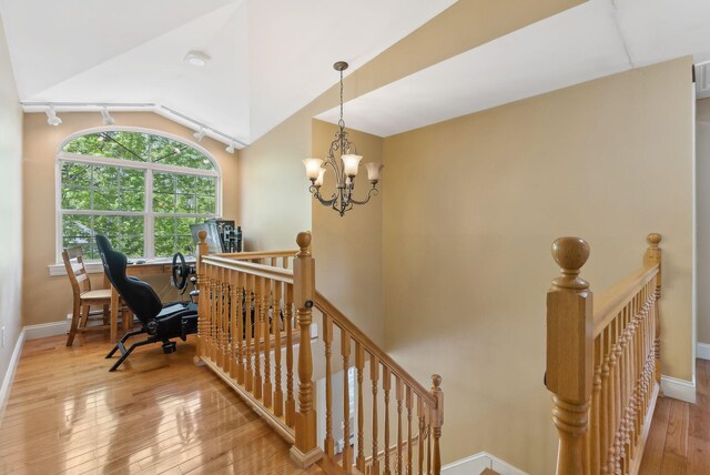 17 S Rd, Winthrop, ME 04364 - staircase with hardwood / wood-style floors, baseboards, a chandelier, and lofted ceiling