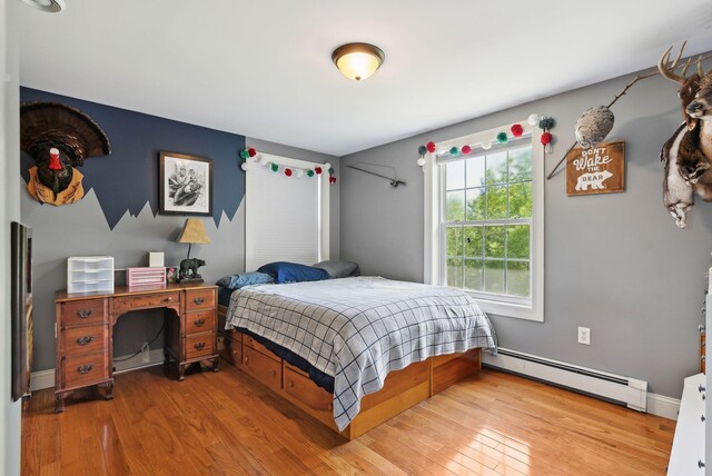 17 S Rd, Winthrop, ME 04364 - bedroom featuring a baseboard radiator and wood finished floors